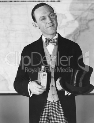 Portrait of man with top hat and bottle