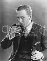 Portrait of man drinking