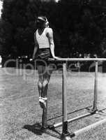 Gymnast on parallel bars outside