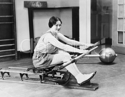 Woman using rowing machine