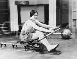 Woman using rowing machine