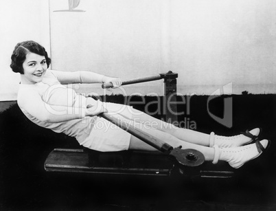 Woman using rowing machine