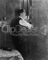 Man at window of prison cell