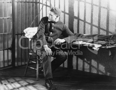 Man in prison cell