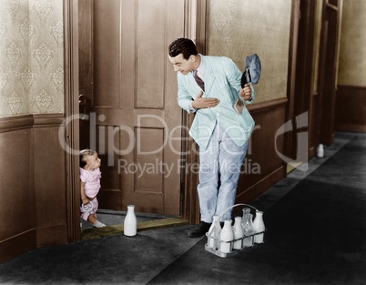 Milkman greeting baby at door