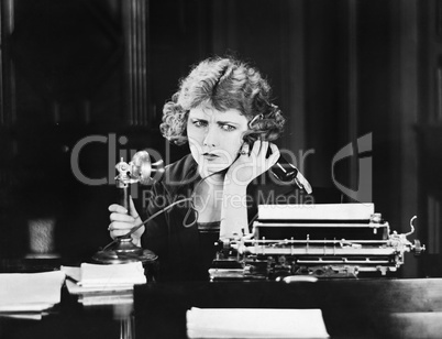 Confused woman on telephone