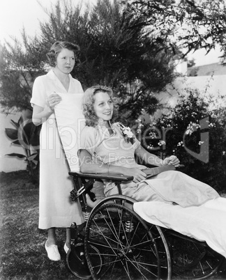 Woman in wheelchair with nurse