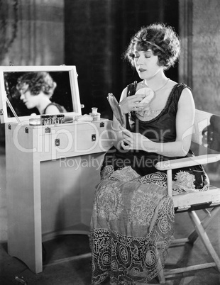 Woman at dressing table