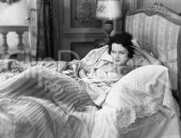 Portrait of woman in bed