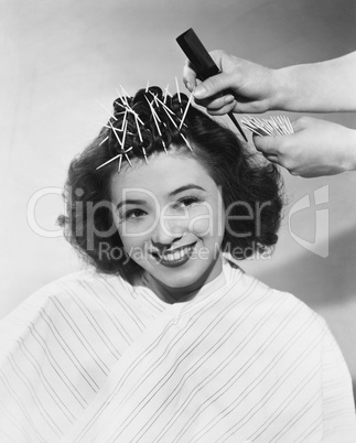 Portrait of woman having hair styled