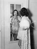 Woman in mirror wearing lingerie