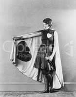 Female sword fighter wearing cape with hearts