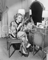 Portrait of woman at dressing table