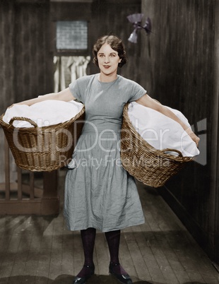 Woman carrying laundry baskets