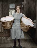 Woman carrying laundry baskets