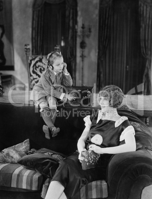 Boy and mother with radio