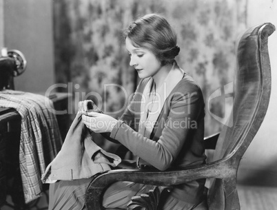 Portrait of woman sewing