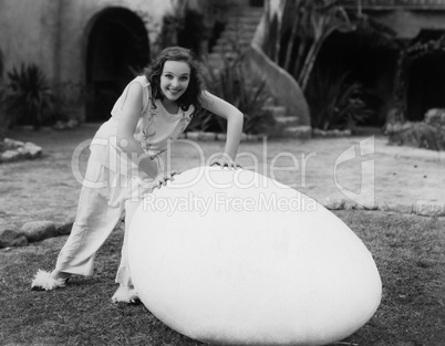 Woman outside with giant egg