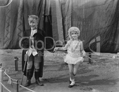 Little boy and girl dressed up