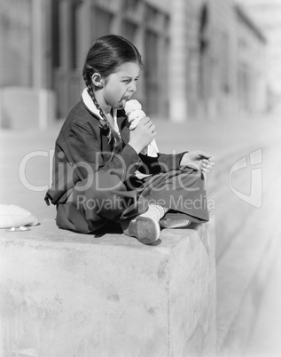 Portrait of girl eating ice cream cone