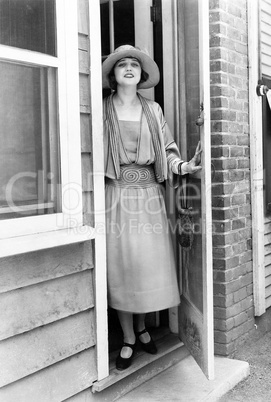 Portrait of woman in doorway