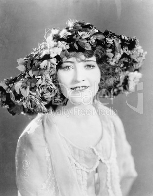 Portrait of woman with hat of flowers