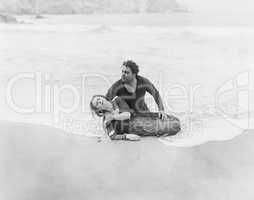 Man rescuing woman from ocean