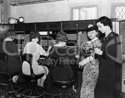 Telephone operators at switchboard