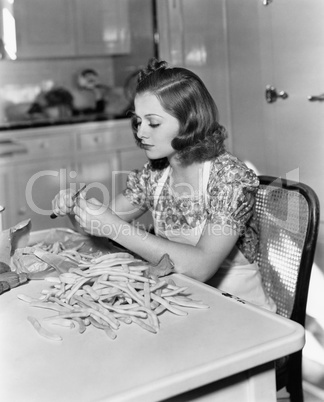 Woman trimming beans
