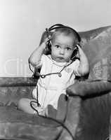 Portrait of baby wearing headphones