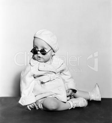 Baby wearing beret and sunglasses