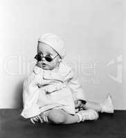 Baby wearing beret and sunglasses