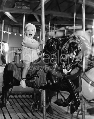 Toddler on carousel