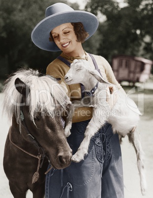 Woman with goat and pony