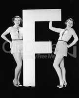 Twins with huge letter F