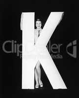 Woman with huge letter K