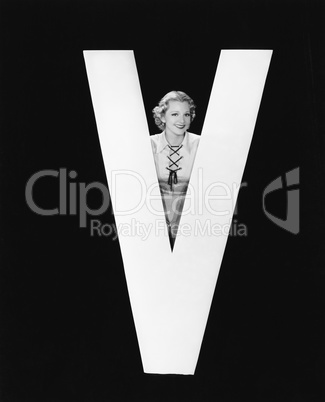 Woman posing with huge letter V