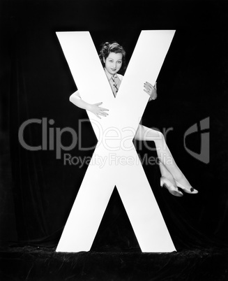 Woman with huge letter X
