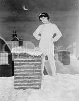 Young woman looking at chimney on snowy roof