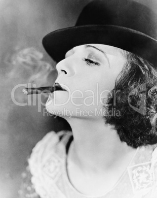 Closeup of woman smoking cigar
