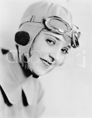 Portrait of woman in racing hat and goggles