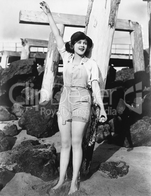 Woman with pilings at beach