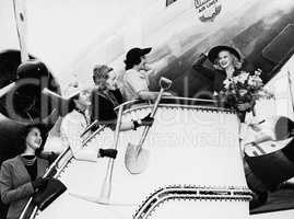 Women sending off friend boarding plane