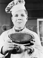 Portrait of chef with pie