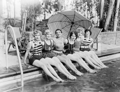 Portrait of female friends at pool