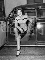 Portrait of woman in drivers seat of car