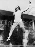 Jumping woman in midair