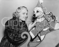Woman with dog in Christmas outfit