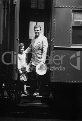 Man and son on train