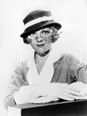 Portrait of woman wearing hat with veil